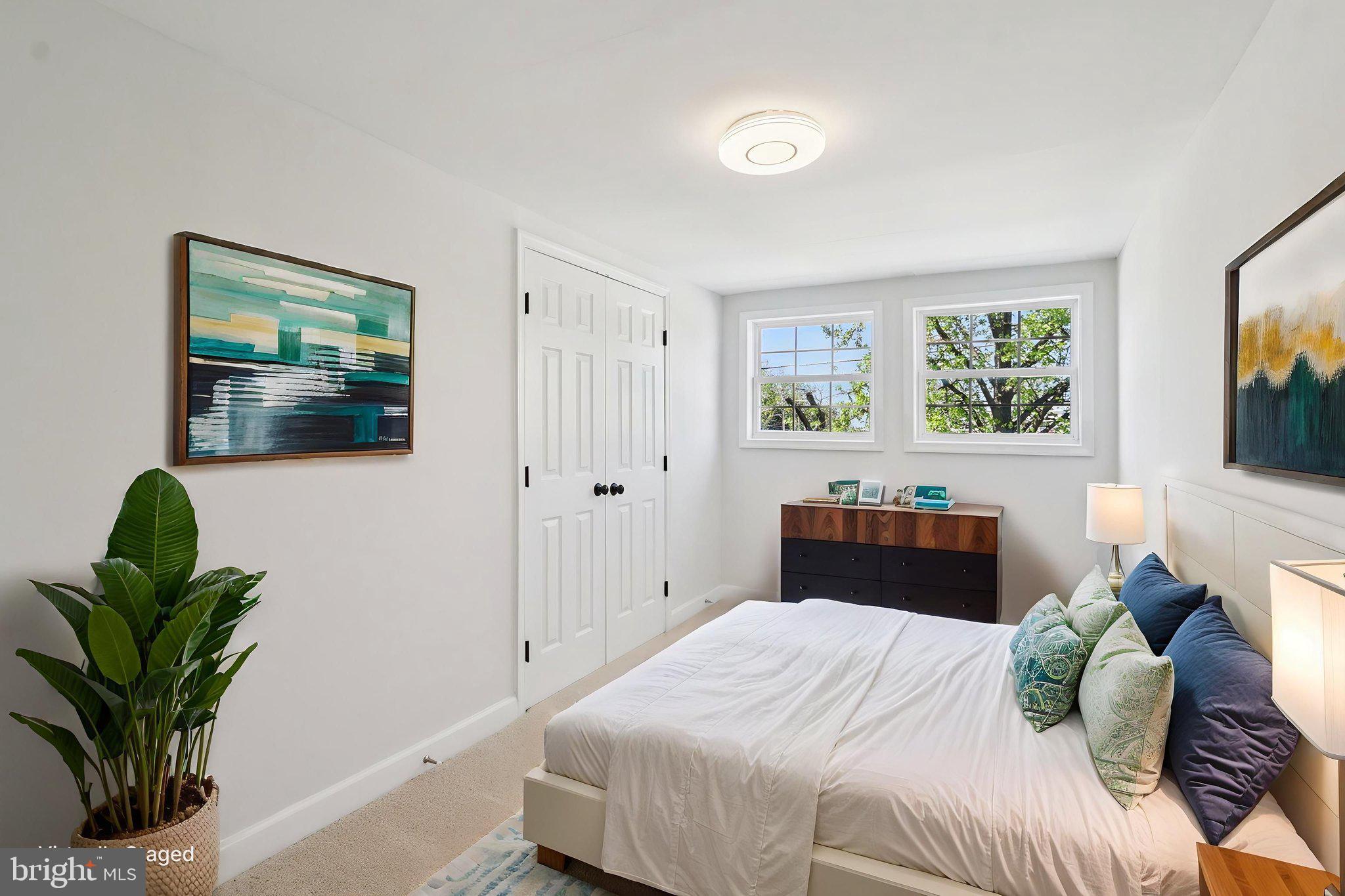 4357 Southern Avenue Southeast Capitol Heights, MD 20743 - Photo 55 of 84 a bedroom with a bed potted plant with the outer view