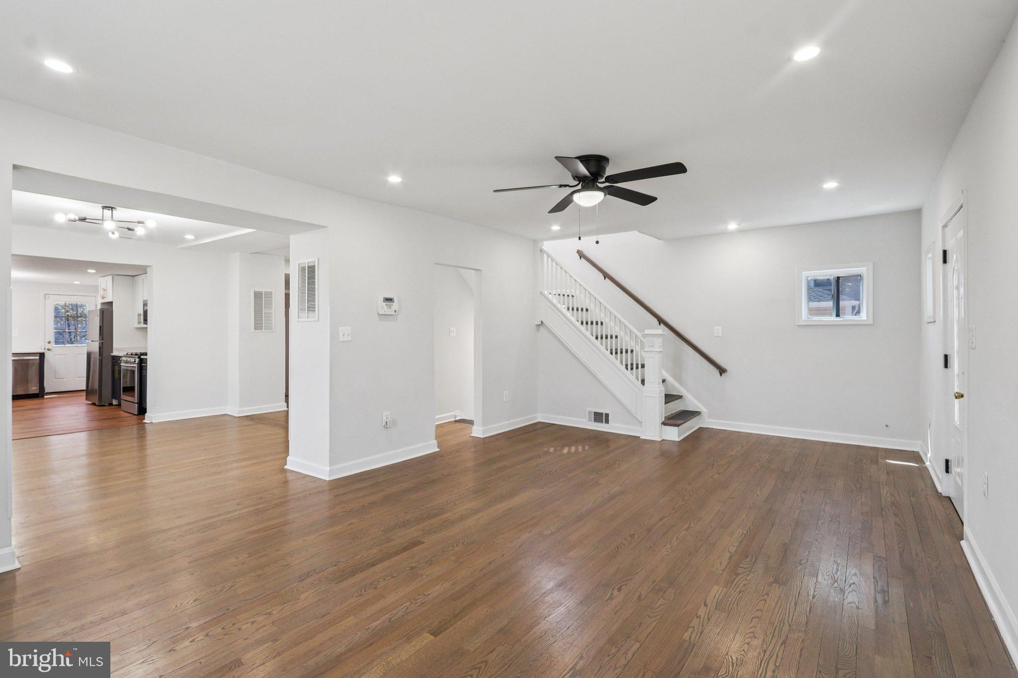4357 Southern Avenue Southeast Capitol Heights, MD 20743 - Photo 10 of 84 a view of an empty room with wooden floor and a ceiling fan