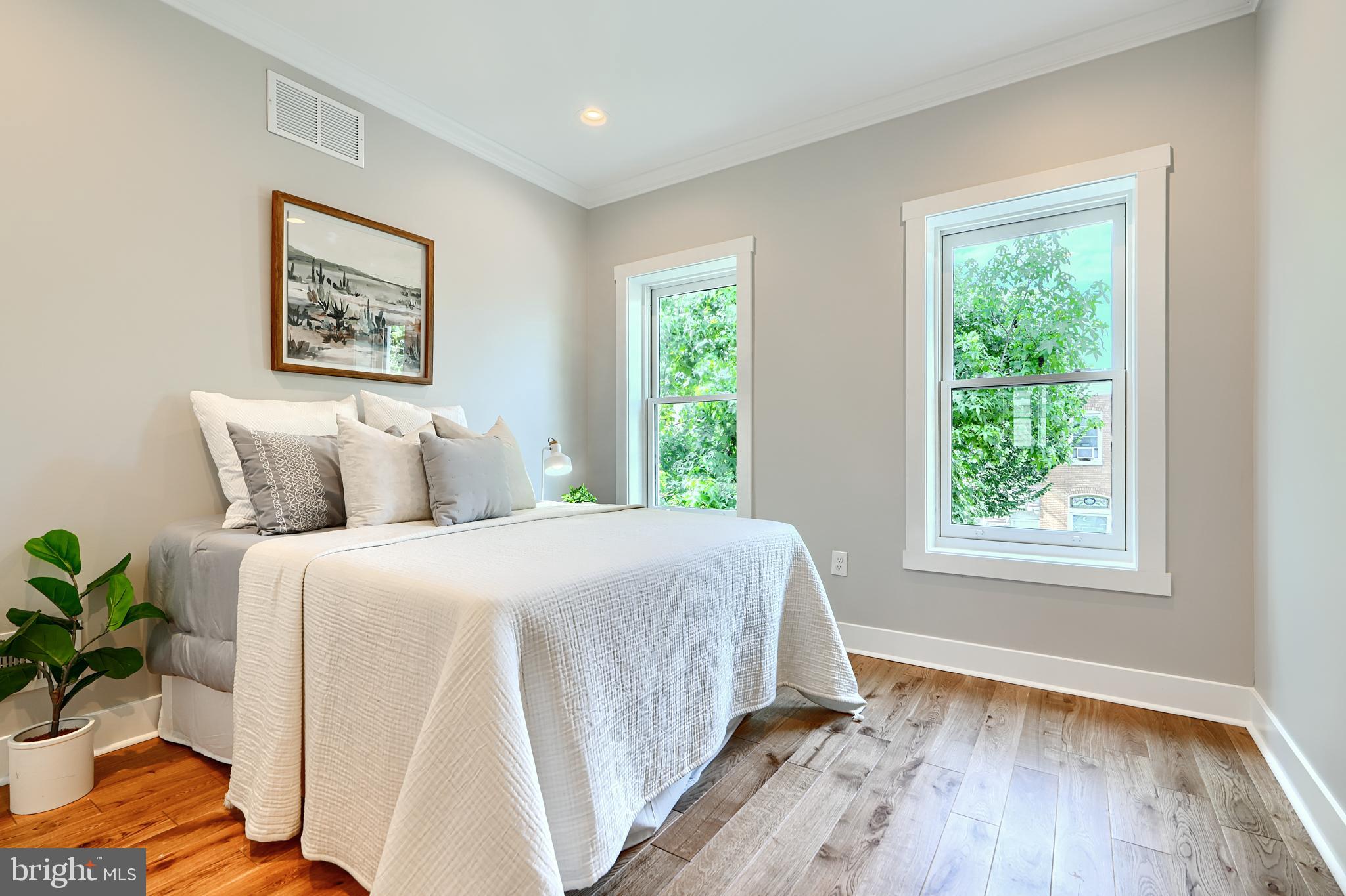 3029 Hudson Street Baltimore, MD 21224 - Photo 18 of 52 a spacious bedroom with a bed and a window