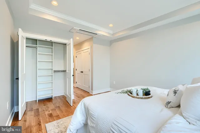 a bedroom with a bed and a sink