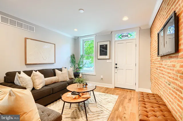a living room with furniture and a rug