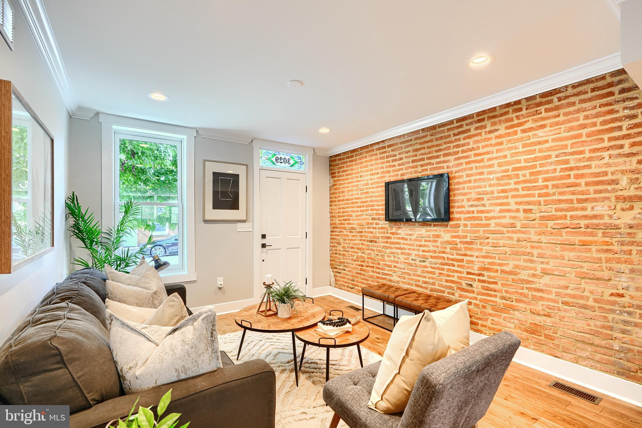 3029 Hudson Street Baltimore, MD 21224 - Photo 9 of 52 a living room with furniture and a flat screen tv
