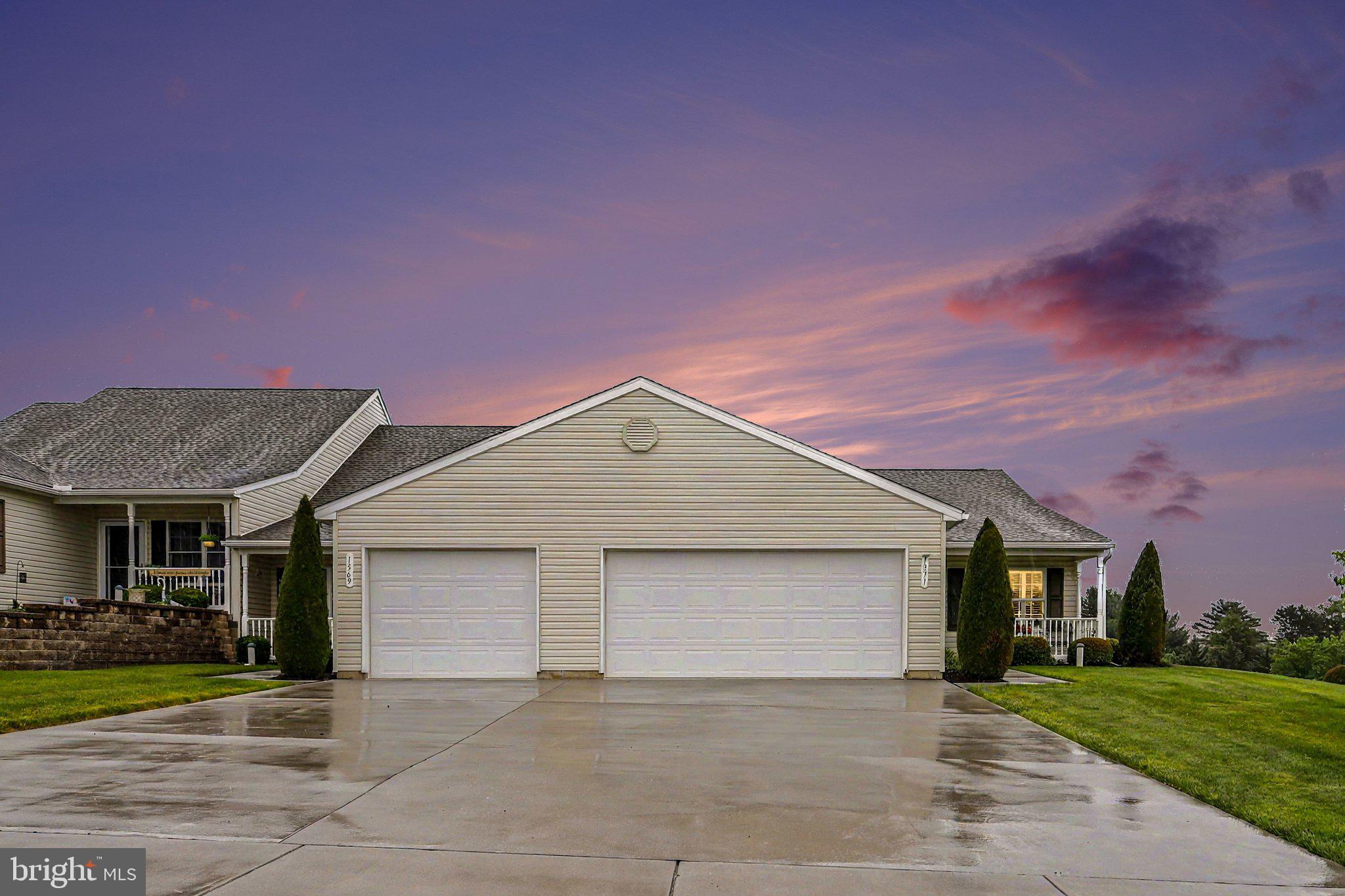 1371 Chami Drive, Unit 166 Spring Grove, PA 17362 - Photo 1 of 28 a front view of a house with a yard and garage