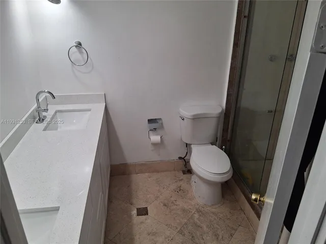 a bathroom with a toilet and a sink