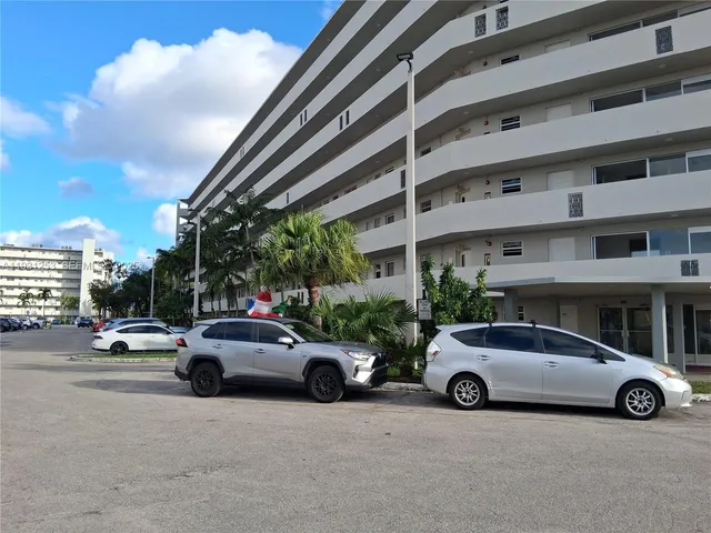a view of a cars parked in front of a building