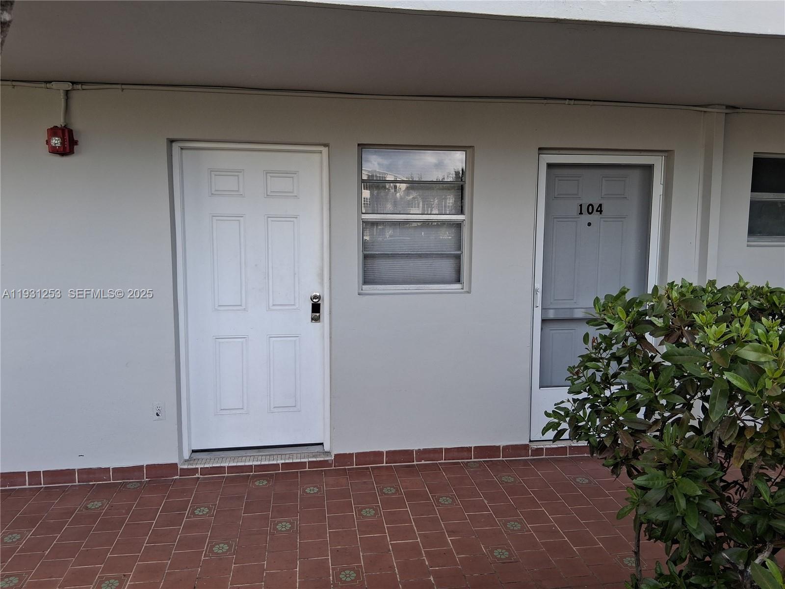 1750 Northeast 191st Street, Unit 1041 Miami, FL 33179 - Photo 7 of 17 a view of a door and a window