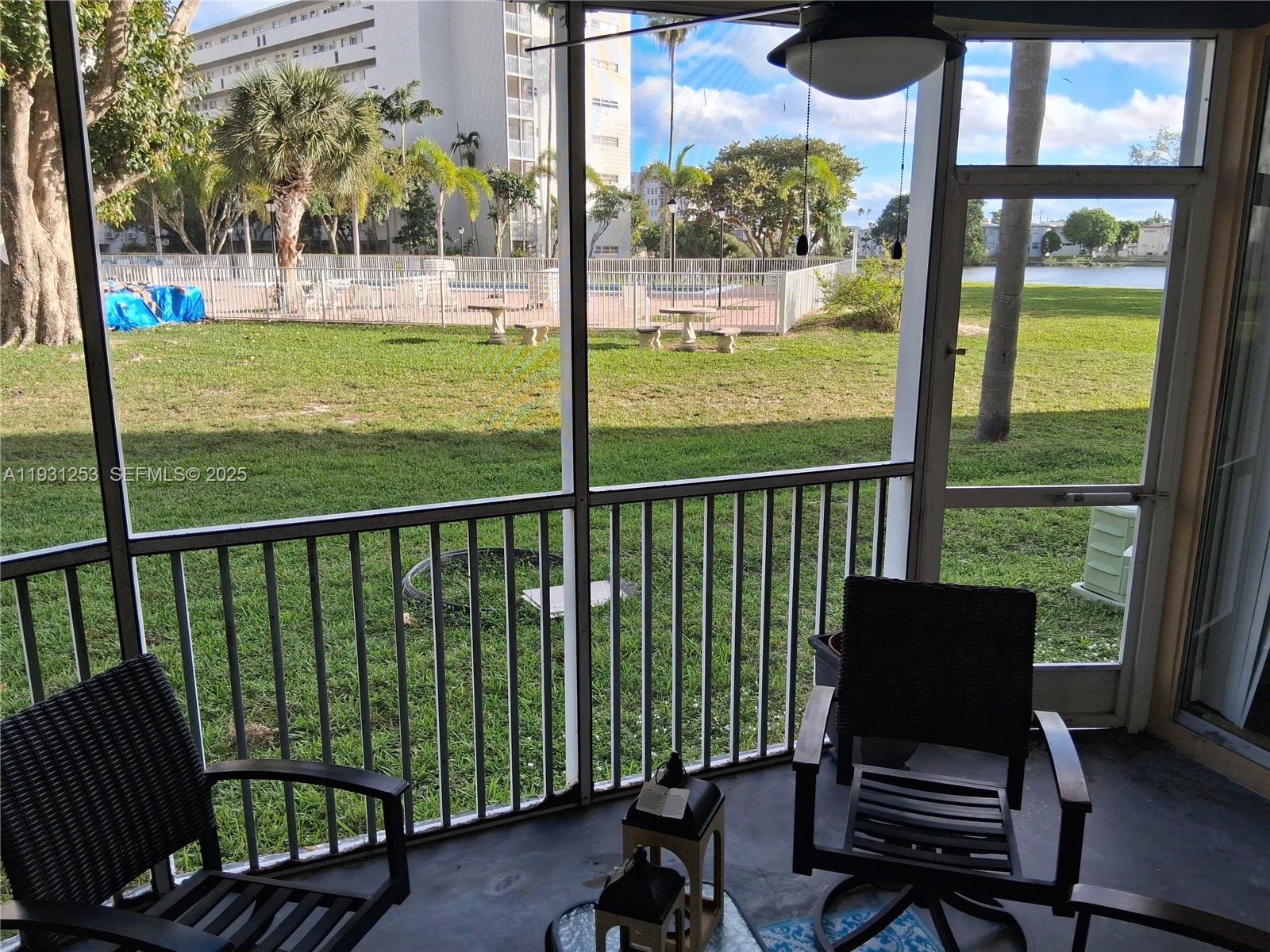 1750 Northeast 191st Street, Unit 1041 Miami, FL 33179 - Photo 8 of 17 a view of a chairs in balcony