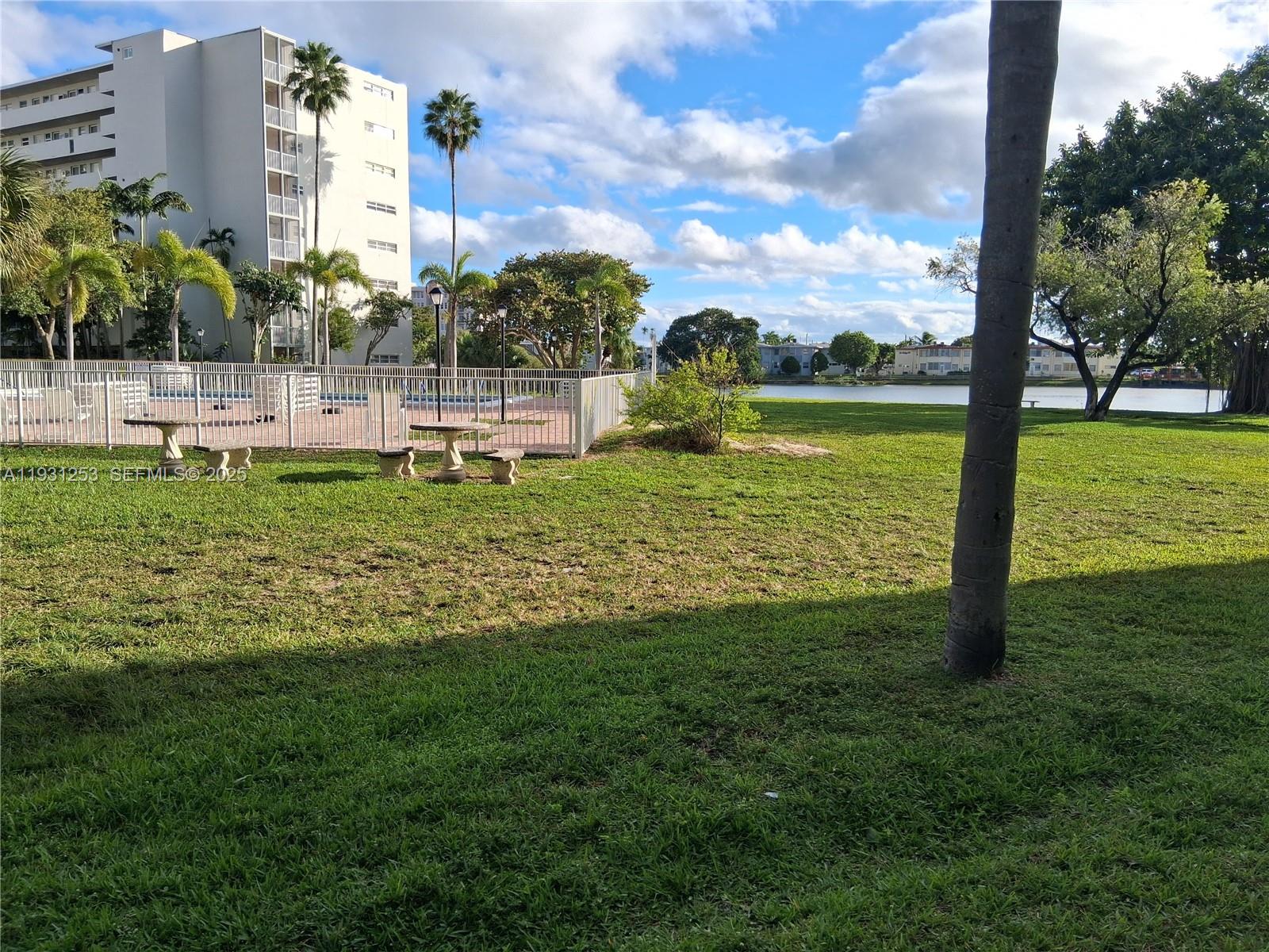 1750 Northeast 191st Street, Unit 1041 Miami, FL 33179 - Photo 9 of 17 a view of a garden with houses