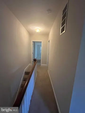 a view of hallway with stairs