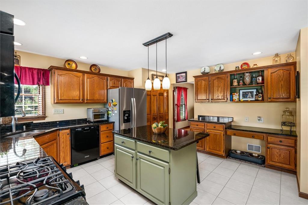 463 Myoma Road Mars, PA 16046 - Photo 11 of 35 a kitchen with stainless steel appliances granite countertop a stove and a sink