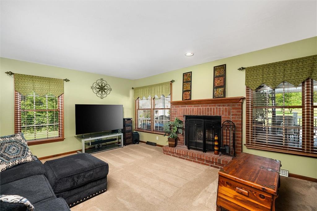 463 Myoma Road Mars, PA 16046 - Photo 14 of 35 a living room with furniture a fireplace and a flat screen tv