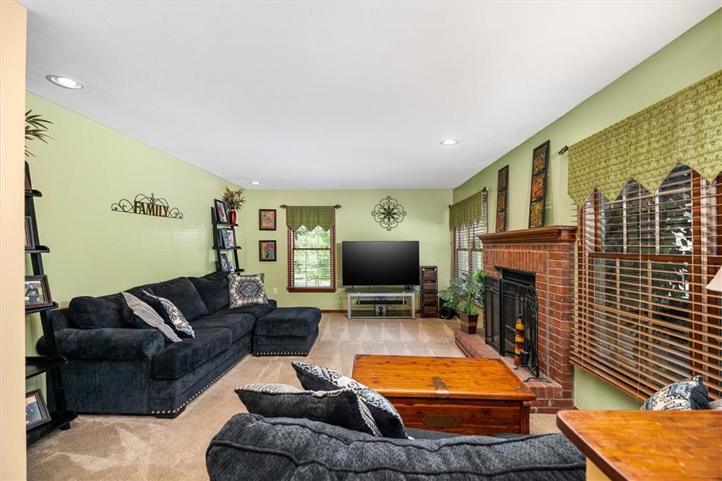 463 Myoma Road Mars, PA 16046 - Photo 15 of 35 a living room with furniture a fireplace and a flat screen tv
