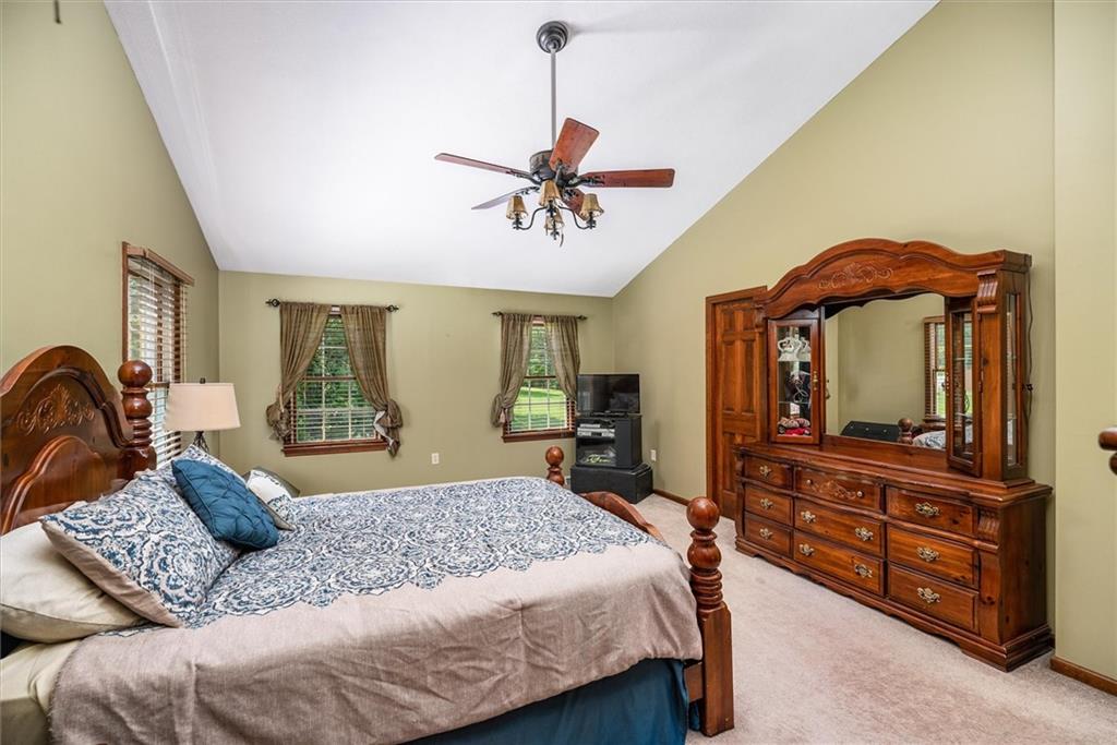 463 Myoma Road Mars, PA 16046 - Photo 20 of 35 a bedroom with a bed dresser and wooden floor