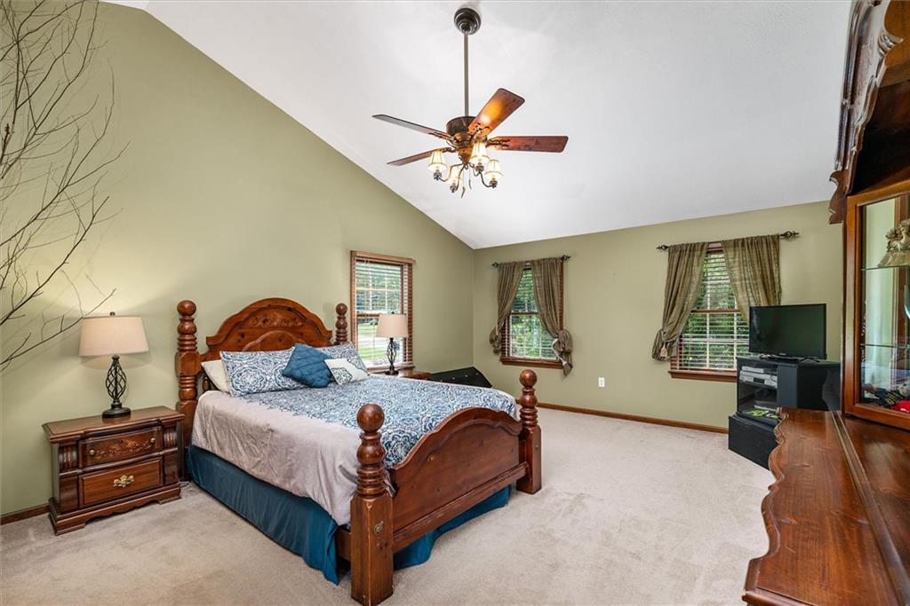 463 Myoma Road Mars, PA 16046 - Photo 21 of 35 a bedroom with a bed and a chandelier
