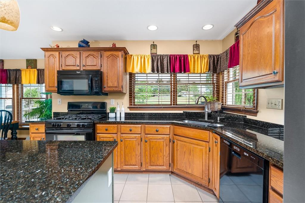 463 Myoma Road Mars, PA 16046 - Photo 10 of 35 a kitchen with stainless steel appliances granite countertop a stove a sink and a microwave