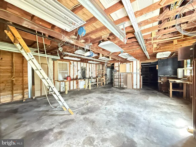 a view of a room with wooden walls