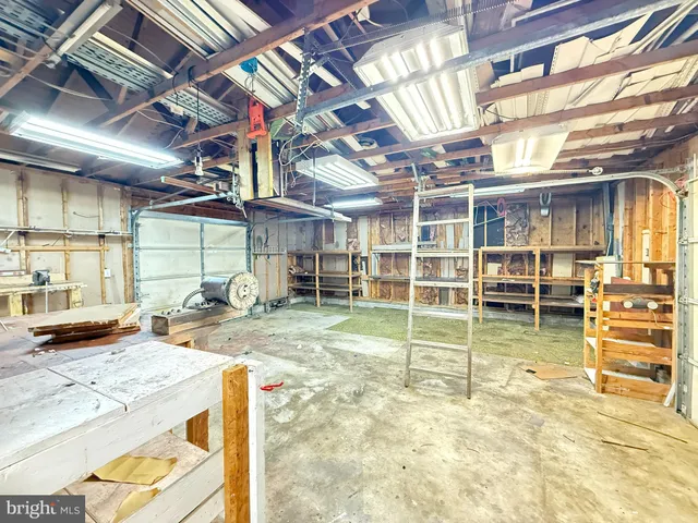 a front view of a house with a garden and deck