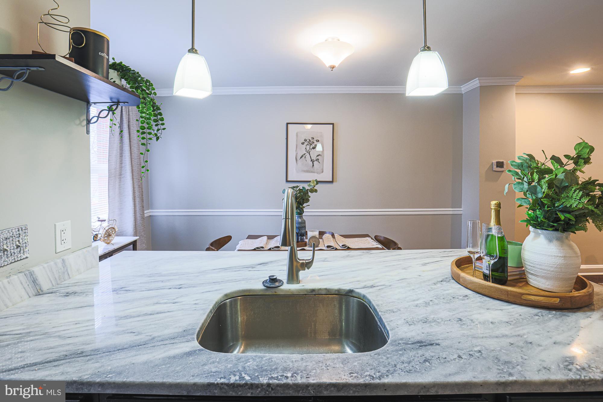 1322 Limit Avenue Baltimore, MD 21239 - Photo 12 of 31 a bathroom with a sink a vanity and a mirror