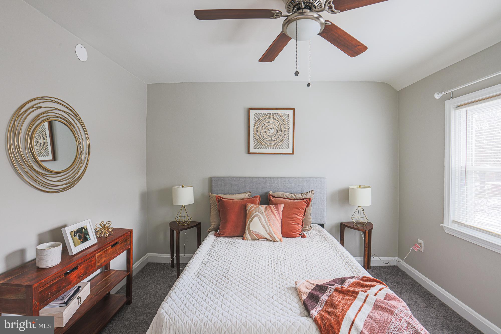1322 Limit Avenue Baltimore, MD 21239 - Photo 14 of 31 a bedroom with a bed and a chandelier