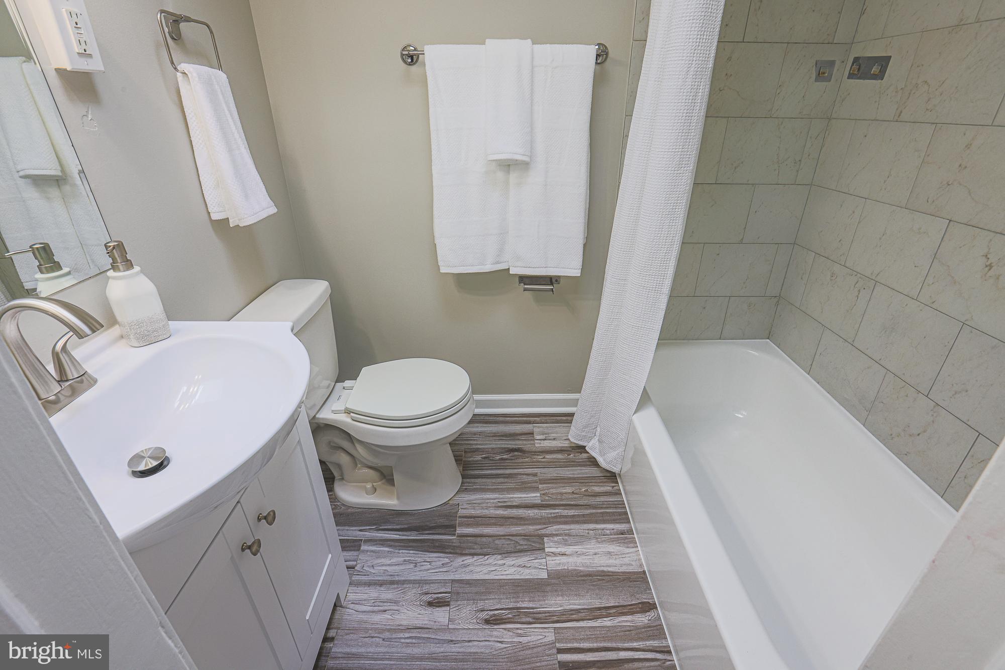 1322 Limit Avenue Baltimore, MD 21239 - Photo 19 of 31 a bathroom with a sink and a toilet