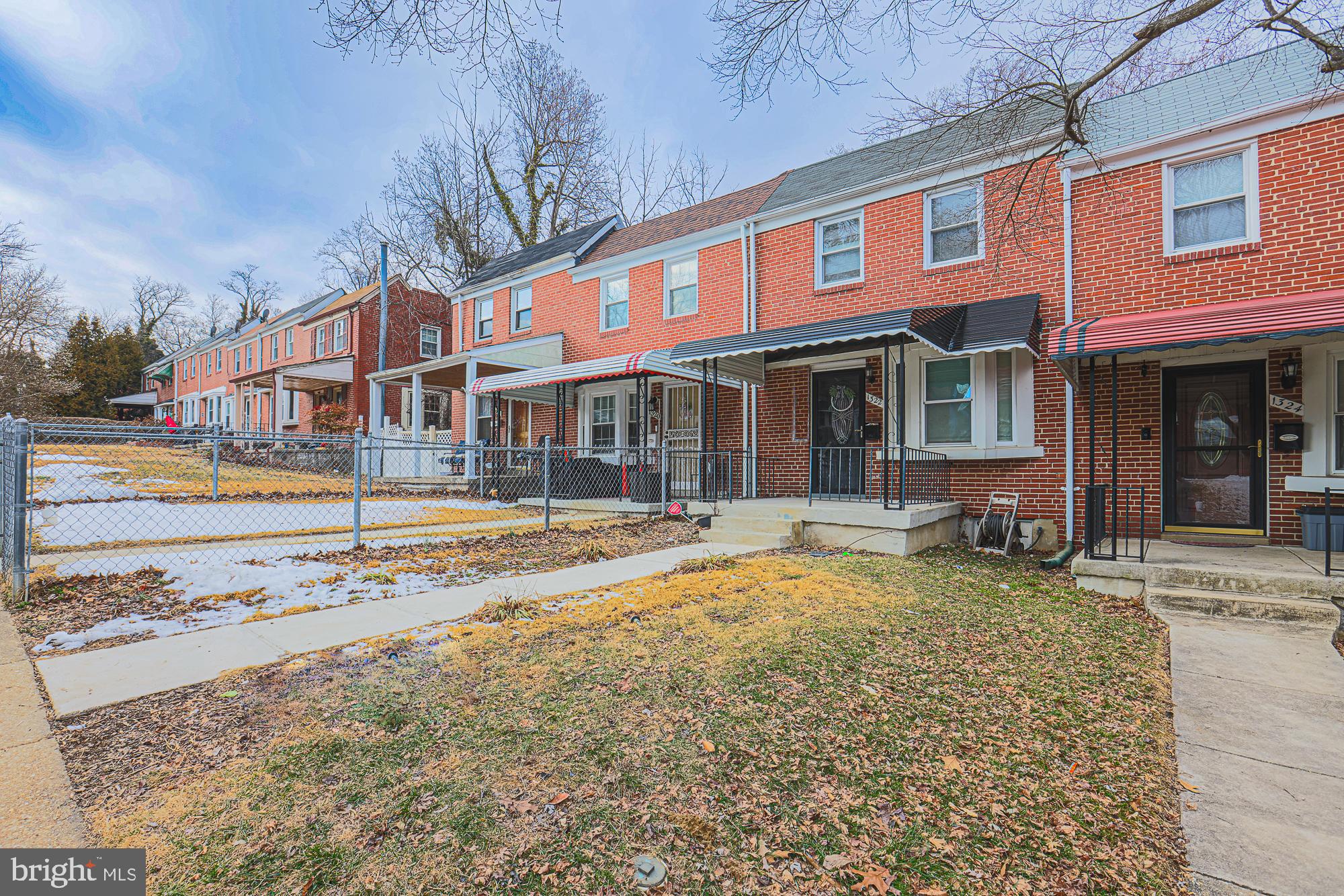 1322 Limit Avenue Baltimore, MD 21239 - Photo 2 of 31 a front view of a building with street view