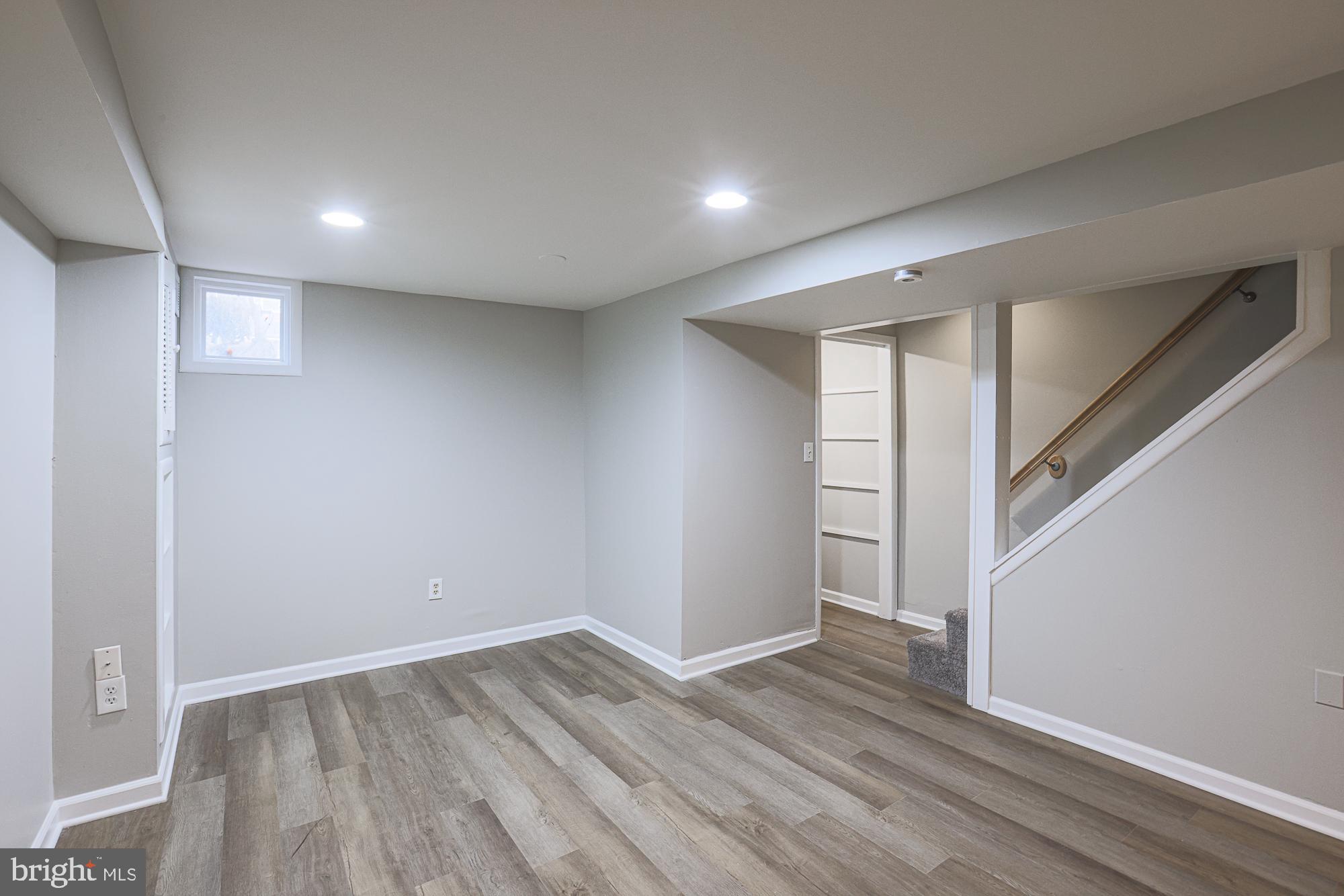1322 Limit Avenue Baltimore, MD 21239 - Photo 26 of 31 a view of an empty room with wooden floor