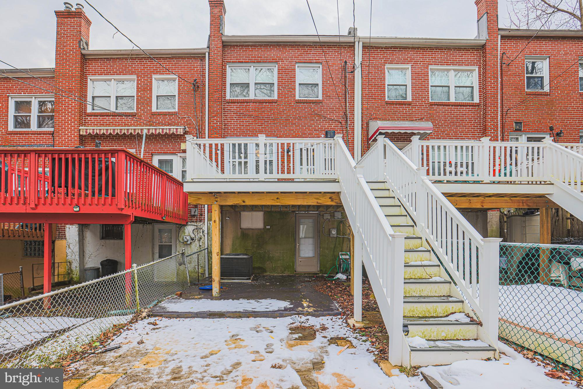 1322 Limit Avenue Baltimore, MD 21239 - Photo 31 of 31 a view of a brick building with a window and balcony