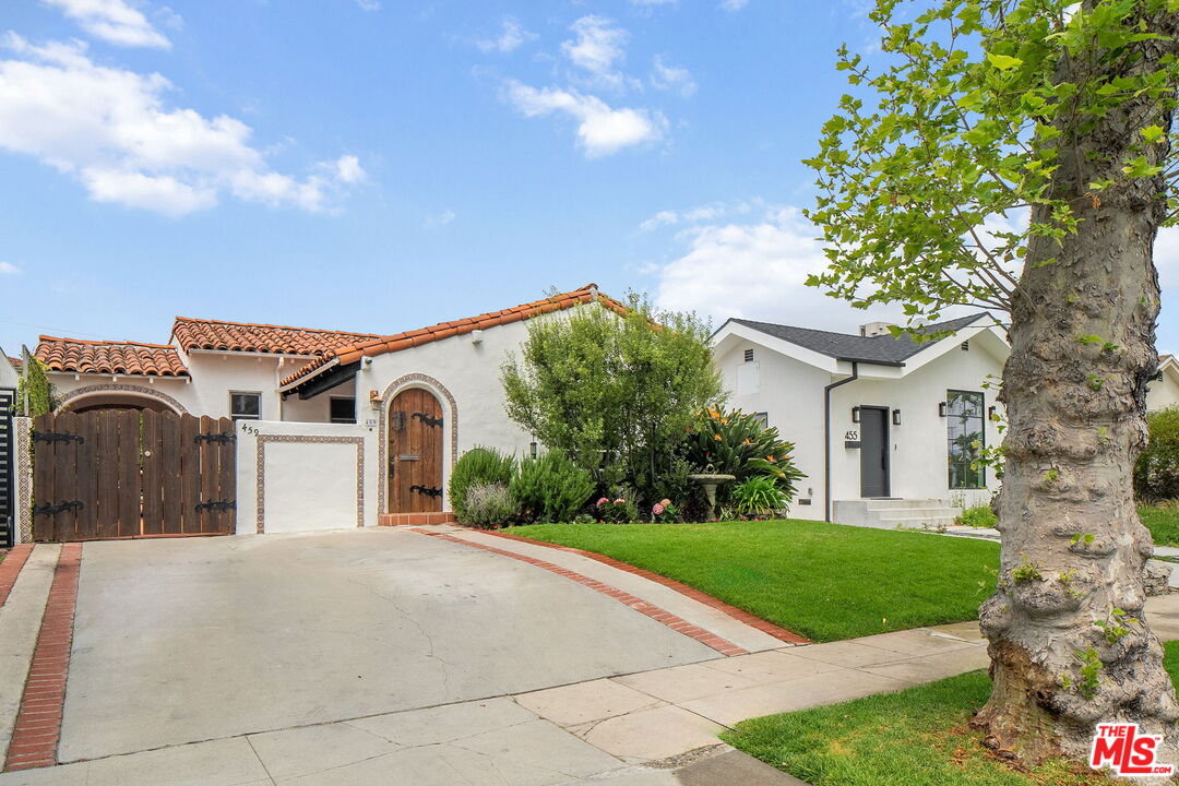459 South La Peer Drive Beverly Hills, CA 90211 - Photo 1 of 1 a view of a house with a yard plants and large tree