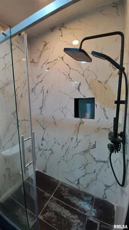 a bathroom with a double vanity sink toilet and mirror