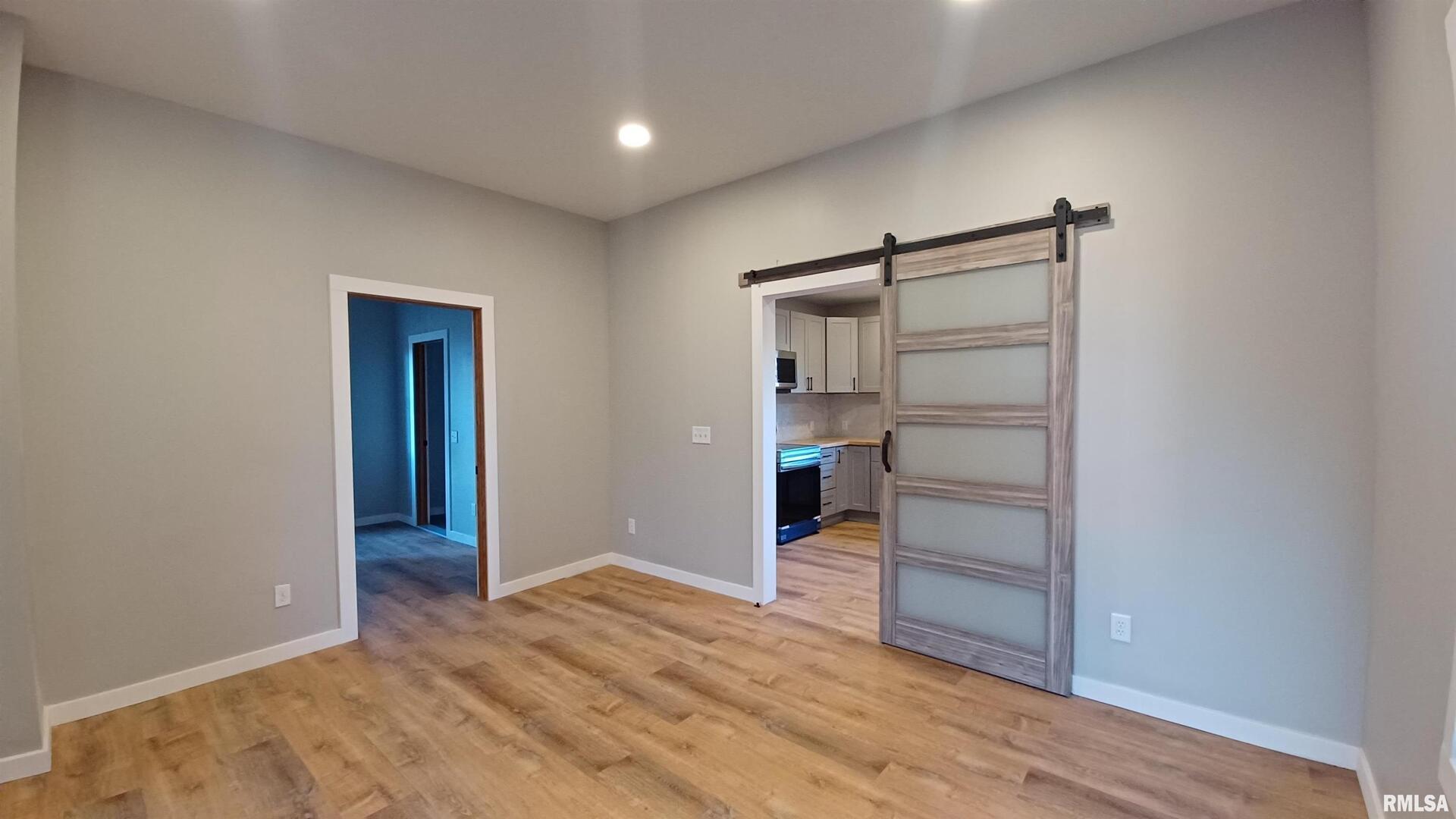 822 6th Avenue South Clinton, IA 52732 - Photo 10 of 28 a view of empty room with wooden floor