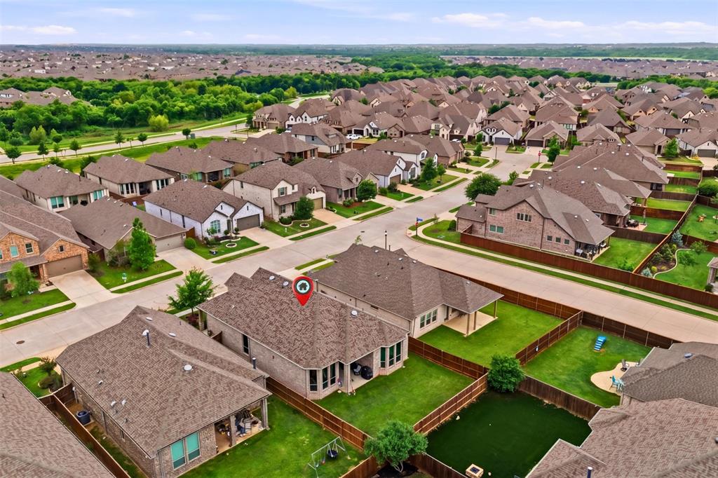 1429 Eclipse Road Aubrey, TX 76227 - Photo 29 of 37 The property is situated in a neighborhood with numerous residential homes, each featuring individual yards