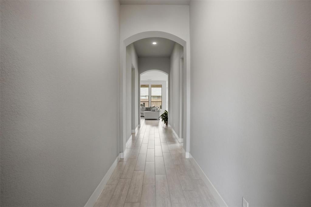 1429 Eclipse Road Aubrey, TX 76227 - Photo 4 of 37 Long and elegant hallway leading to the living room