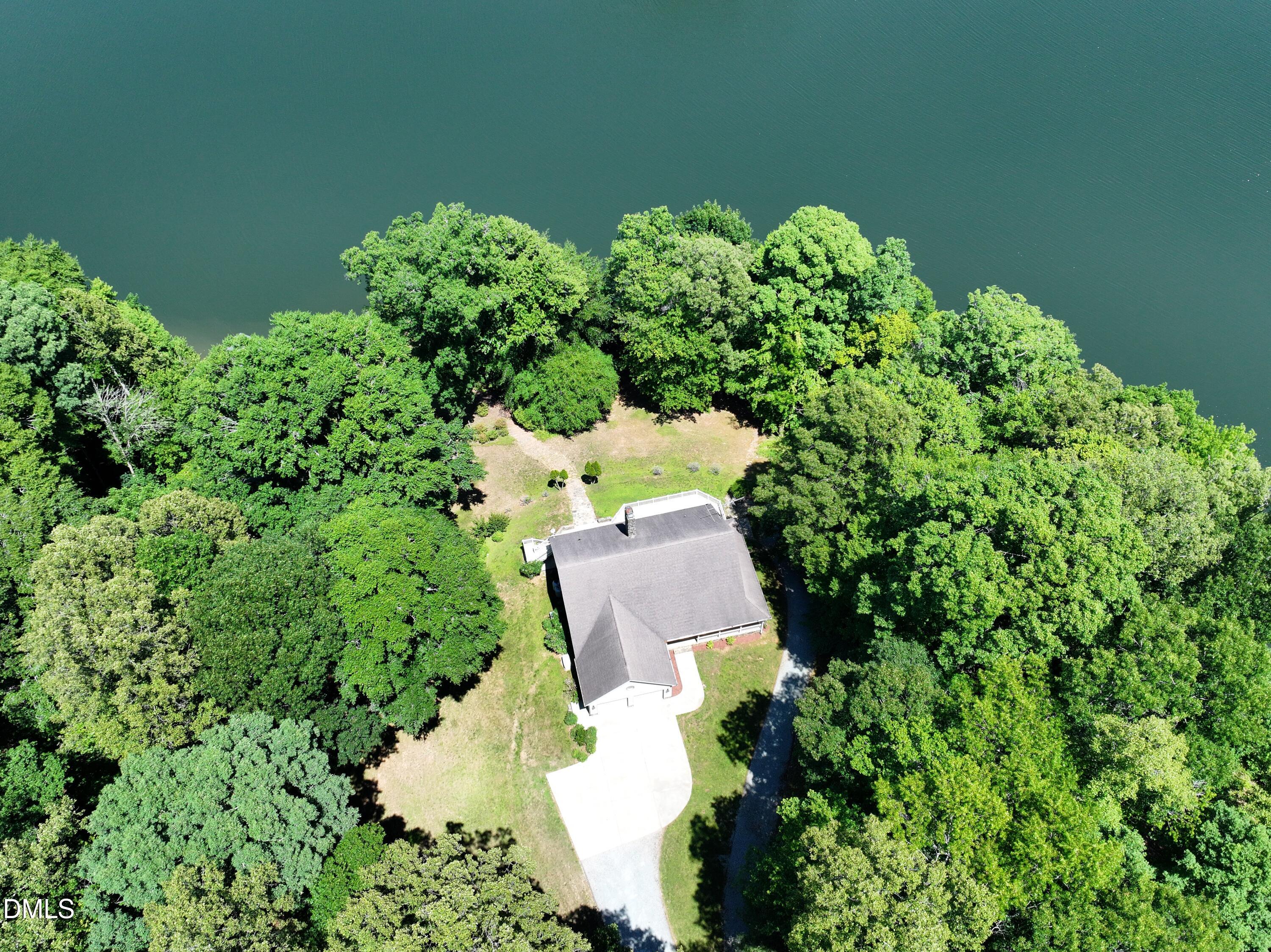 81 Beaver Crossing Road Roxboro, NC 27574 - Photo 69 of 80 an aerial view of a house with a yard