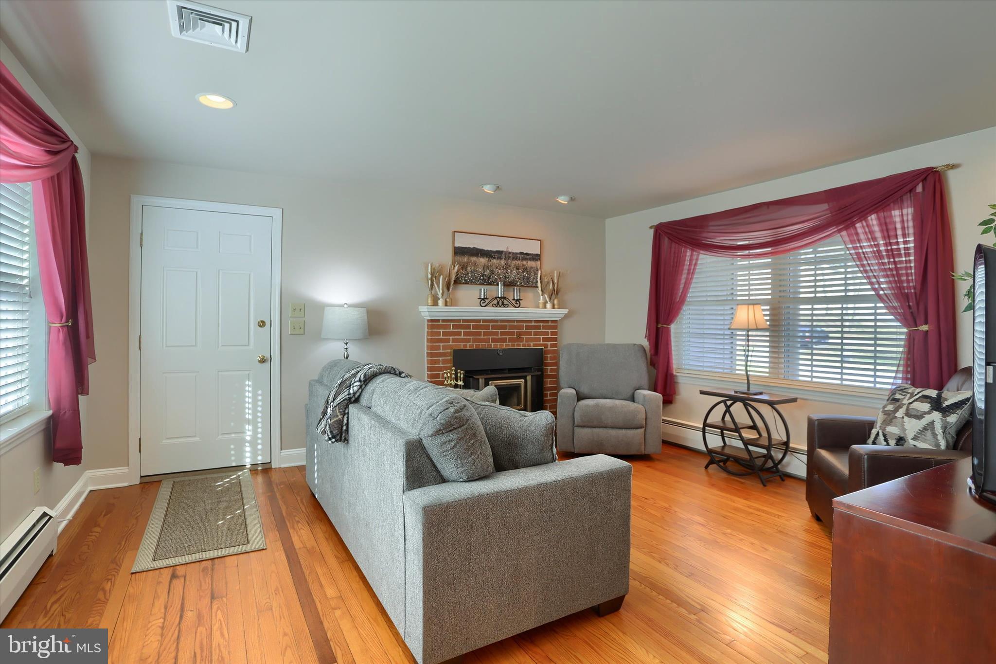 2406 Roundtop Road Middletown, PA 17057 - Photo 11 of 49 a living room with furniture and a fireplace