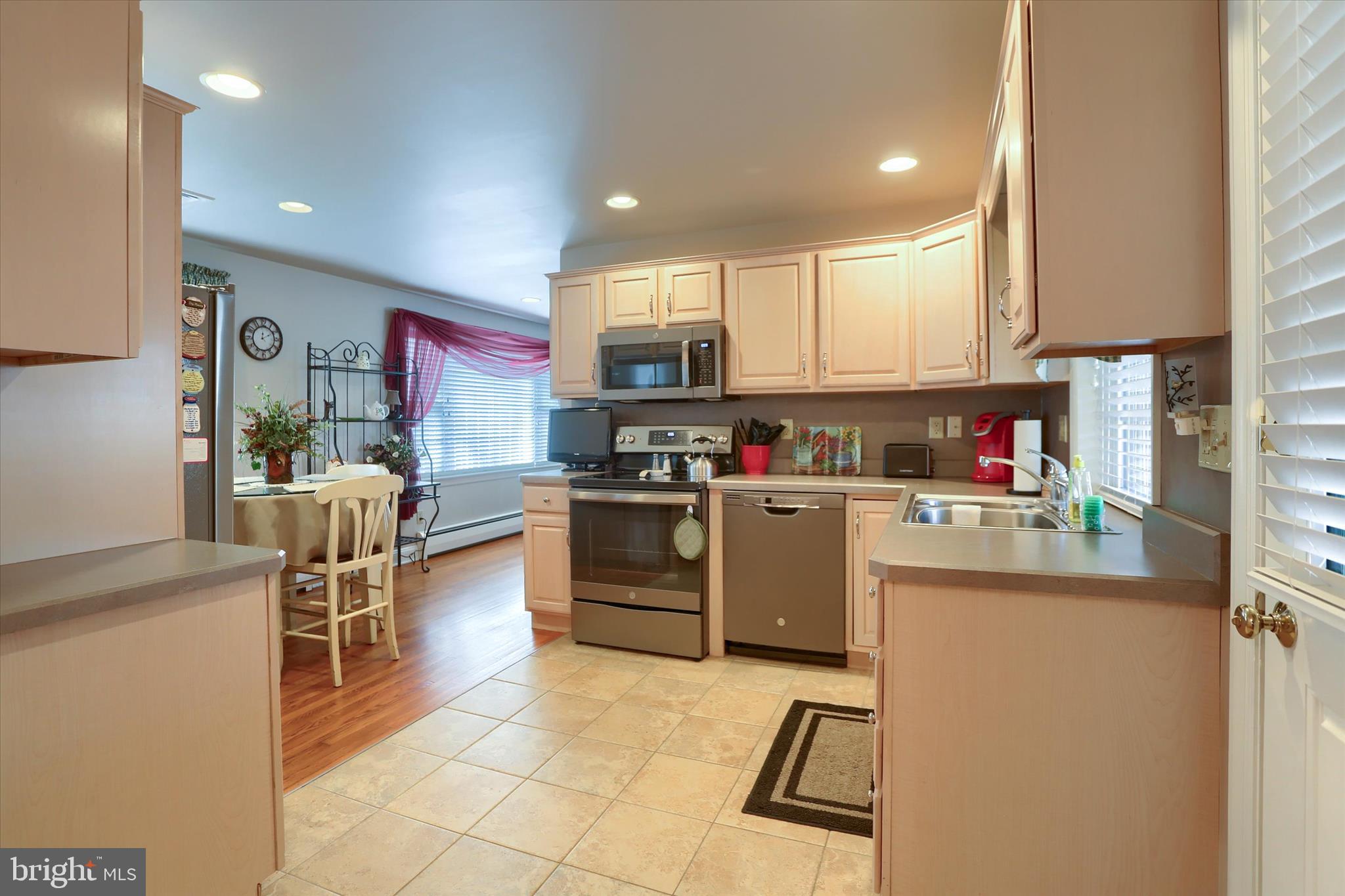 2406 Roundtop Road Middletown, PA 17057 - Photo 19 of 49 a kitchen with stainless steel appliances granite countertop a refrigerator sink and cabinets