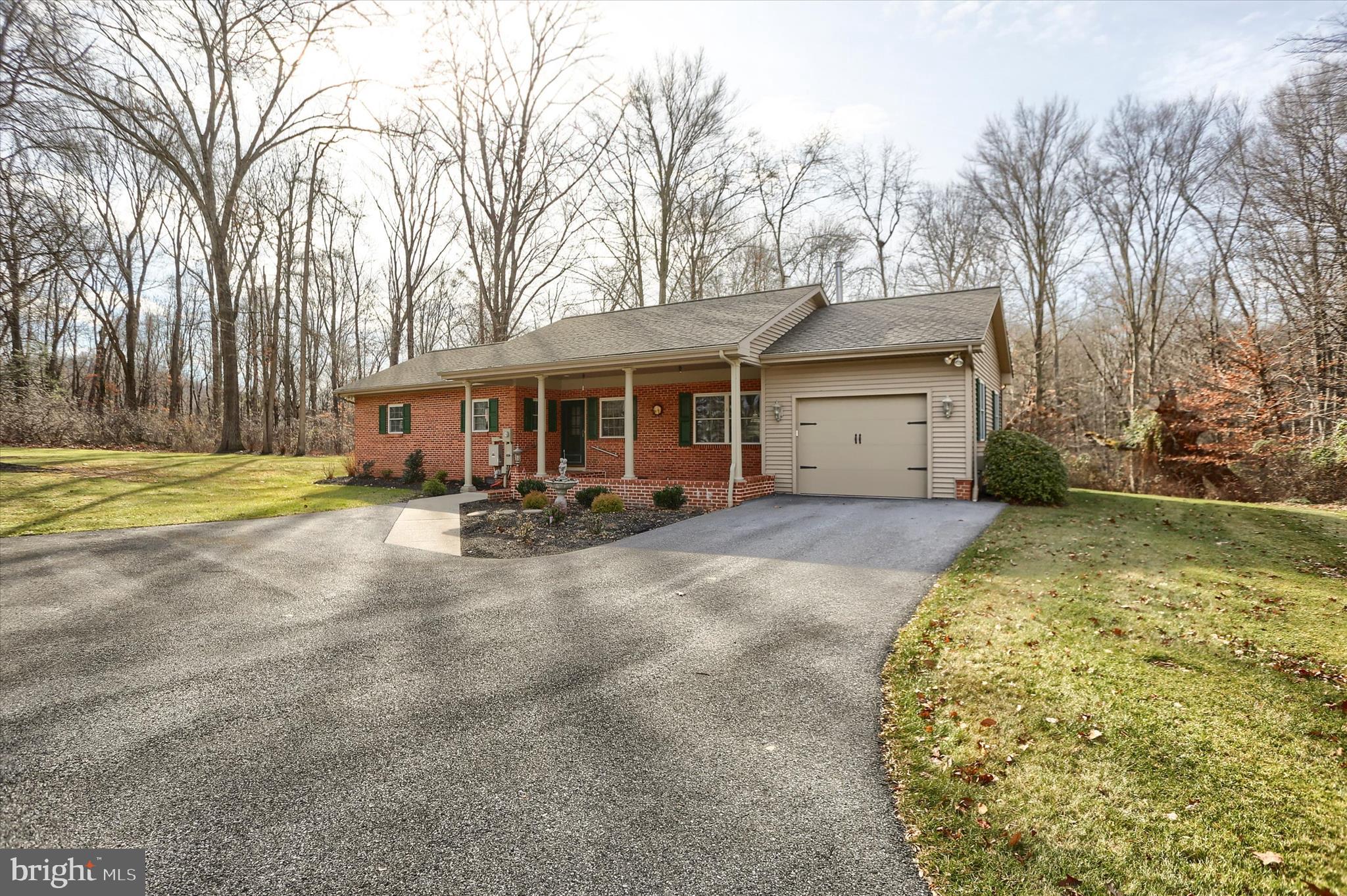 2406 Roundtop Road Middletown, PA 17057 - Photo 2 of 49 front view of a house with a yard and trees
