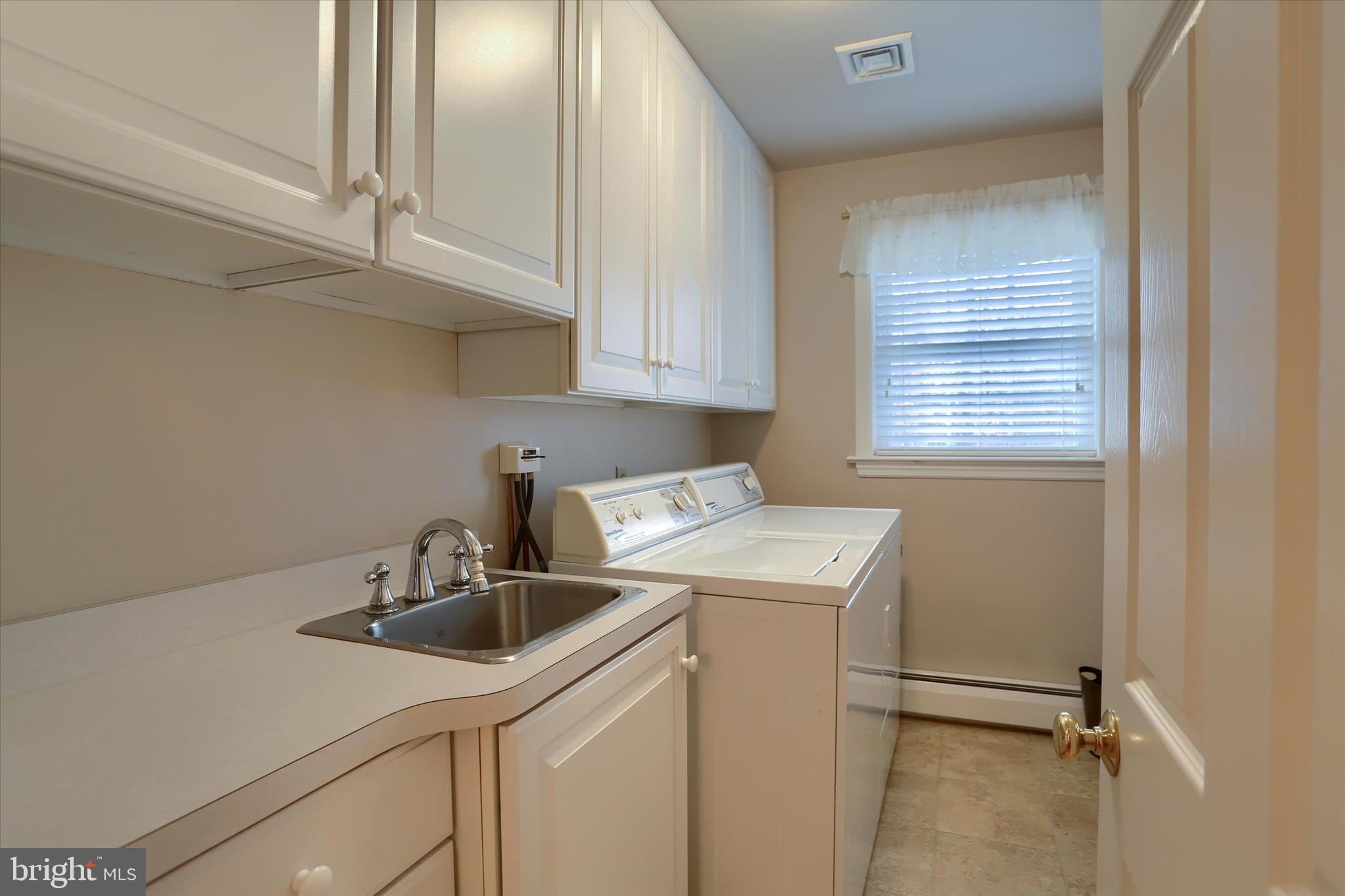 2406 Roundtop Road Middletown, PA 17057 - Photo 27 of 49 a kitchen with a sink cabinets and appliances