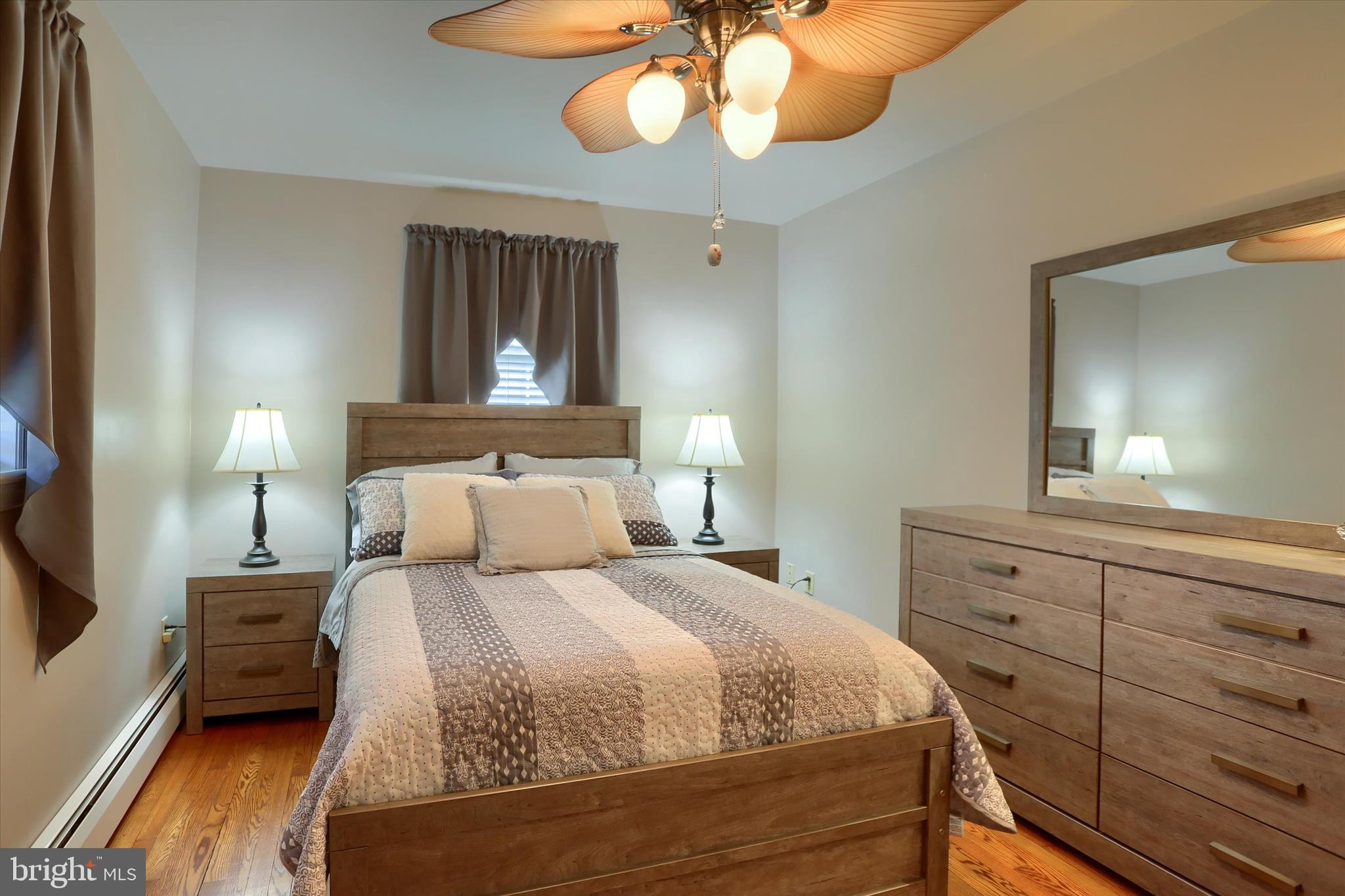 2406 Roundtop Road Middletown, PA 17057 - Photo 28 of 49 a bedroom with a bed and wooden floor