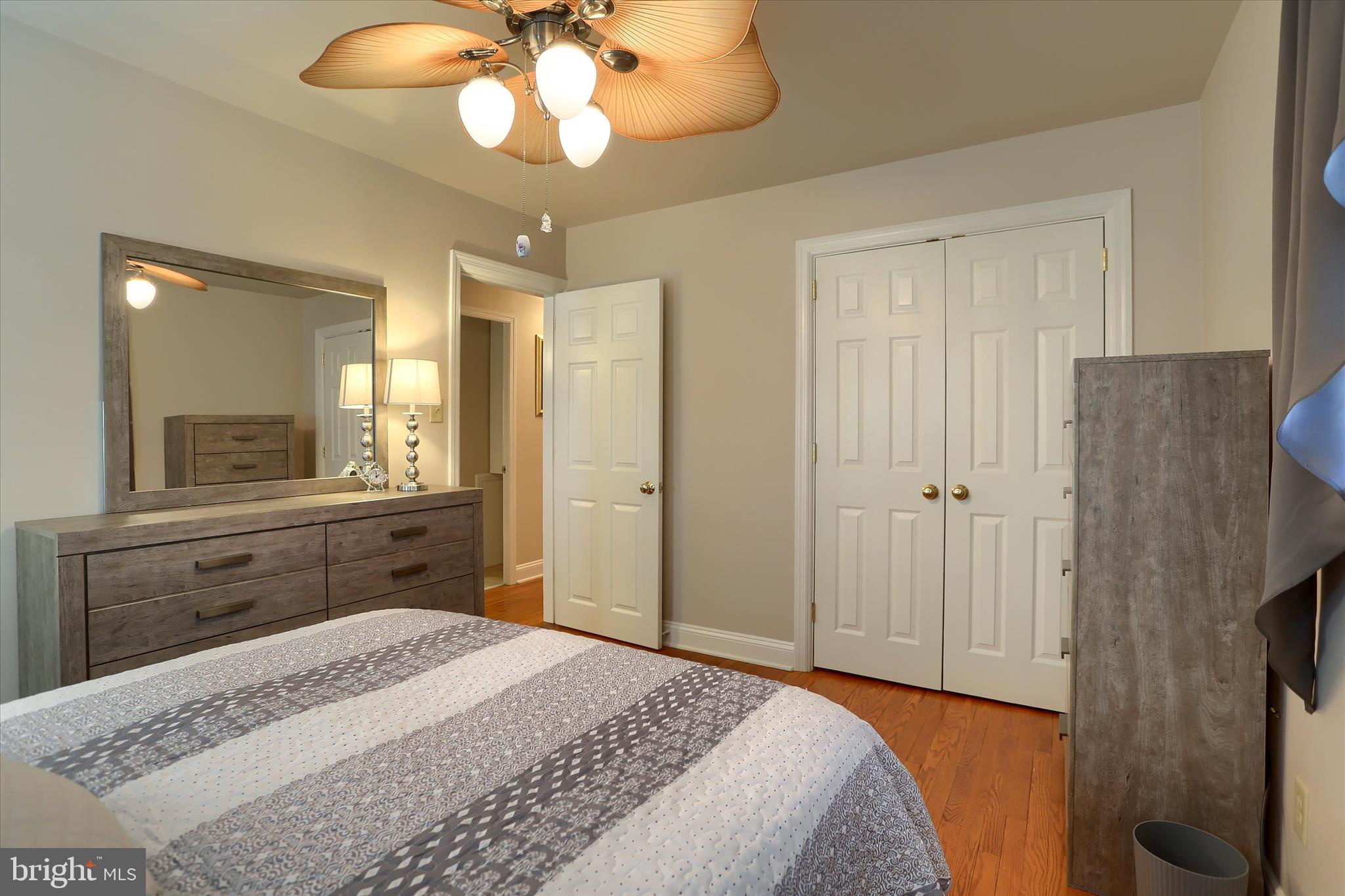 2406 Roundtop Road Middletown, PA 17057 - Photo 29 of 49 a bedroom with a bed and a chandelier