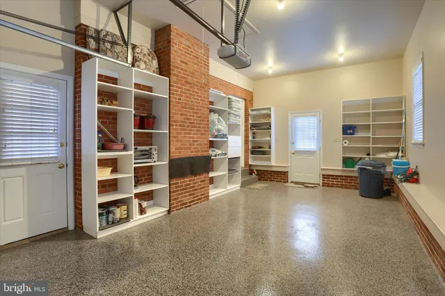 a view of a livingroom with furniture and windows