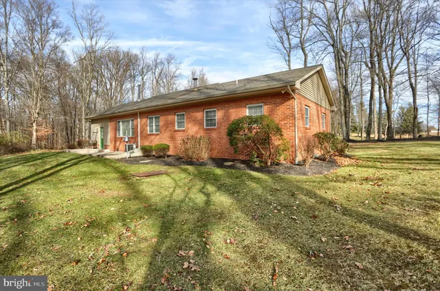 a view of outdoor space with garden and trees