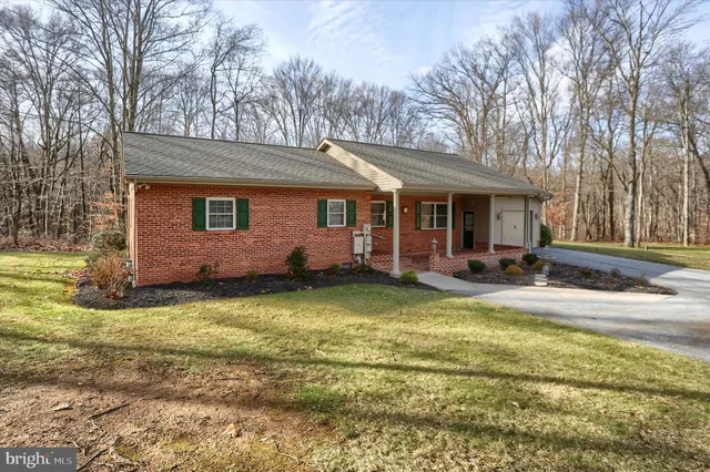 a view of a house with swimming pool and porch