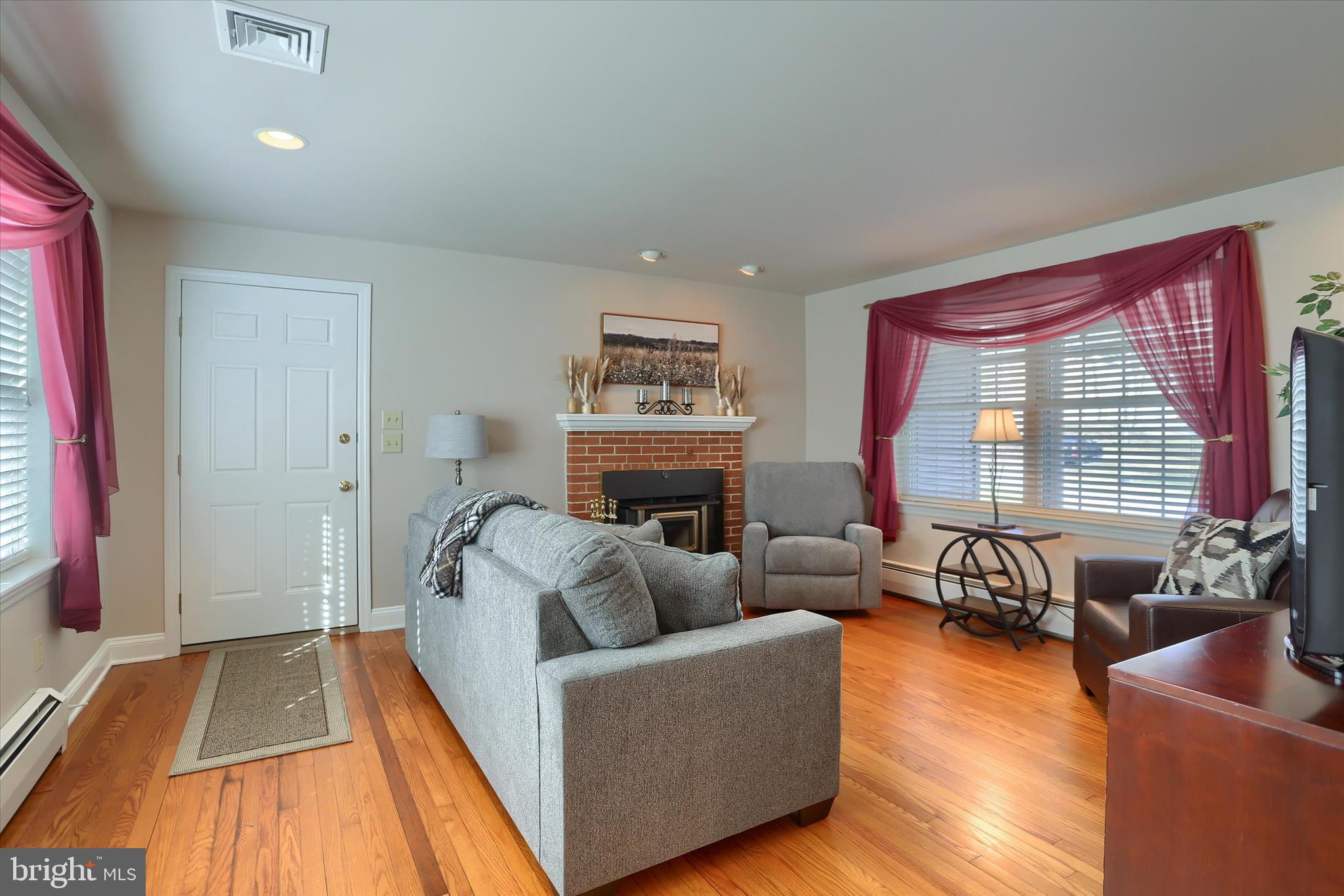 2406 Roundtop Road Middletown, PA 17057 - Photo 10 of 49 a living room with furniture and a fireplace