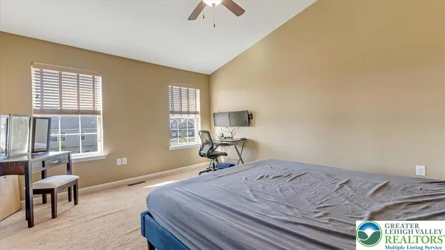 a bedroom with a bed and a couch