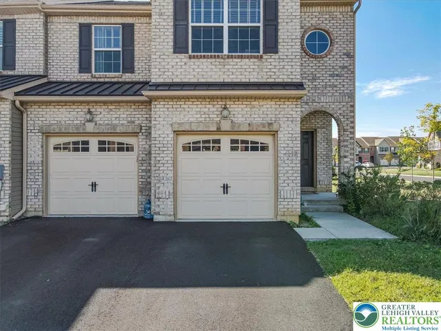 a front view of building with yard