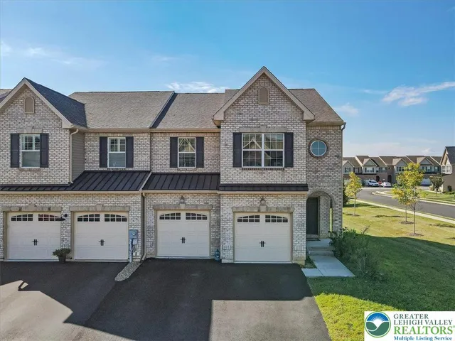 a view of white house with a yard