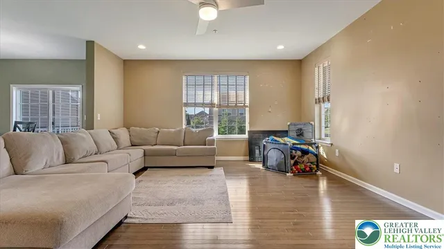 a living room with furniture and a large window