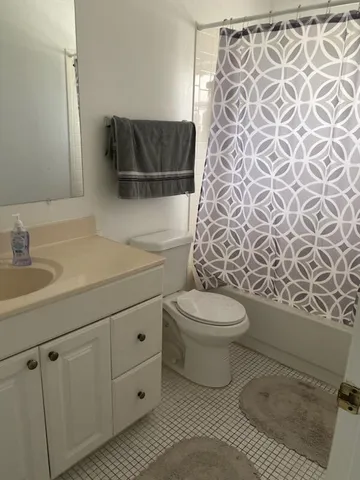 a bathroom with a toilet and a sink