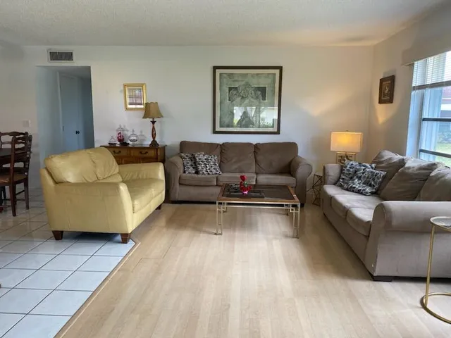 a living room with furniture and a couch
