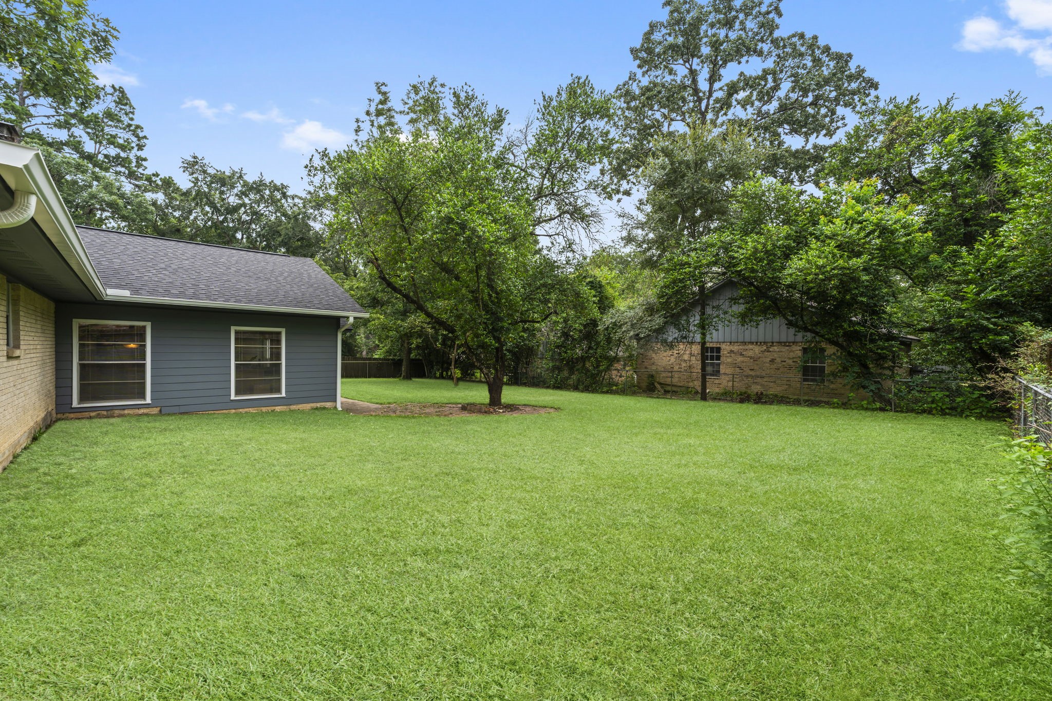209 Summit Drive Conroe, TX 77303 - Photo 20 of 23 One of the property's most compelling features—a rare 15,000 square foot lot offering room to spread out and enjoy.
